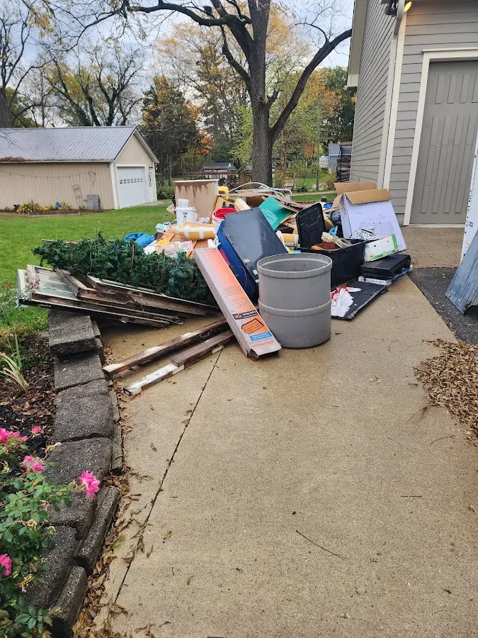 Dumpster being loaded with debris for Demolition Dumpster Rental in Indiana